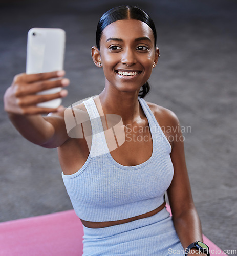 Image of Fitness selfie, sports floor and woman with social media post, profile picture update or wellness website blog on mobile app. Smartphone photography, Indian athlete and pilates or cardio gym training