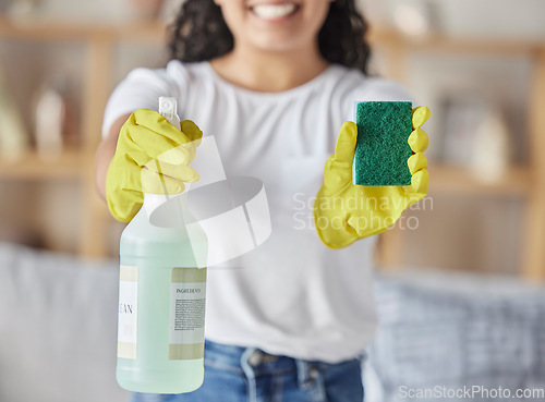 Image of Sponge, spray and woman with cleaning products in home for hygiene, health and wellness. Spring cleaning, housekeeper and happy female holding equipment for washing, sanitizing or disinfecting house.