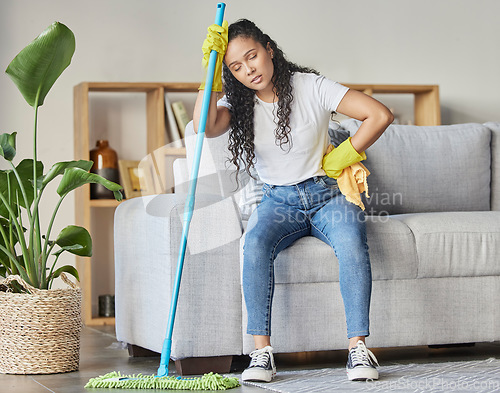 Image of Cleaning, tired and mop with woman in living room for housekeeping, hygiene or disinfection. Pain, exhausted and fatigue with girl cleaner resting after domestic and tidy for dirt, bacteria or dust