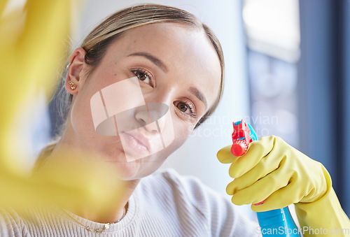 Image of Cleaner woman, spray and bottle in portrait while working with product, detergent or sanitizer in home. Hygiene worker, cleaning and spray bottle for germs, bacteria and dirt at apartment in Toronto