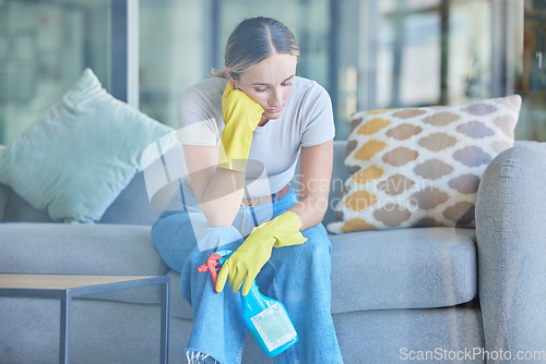 Image of Tired, thinking and woman cleaning home on break with fatigue, unhappy and frustrated with routine. Spring cleaning, burnout and exhausted girl holding detergent spray thoughtful on lounge sofa.