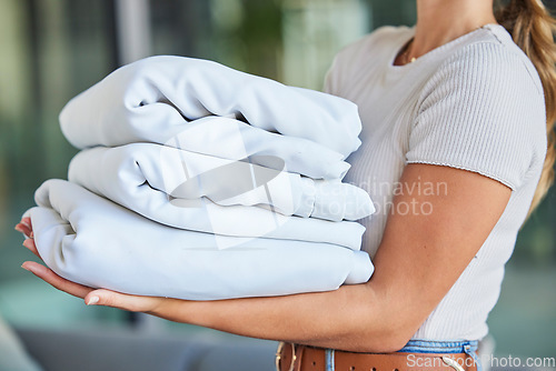 Image of Fabric, laundry and cleaner, woman and cleaning, hygiene and household maintenance with house work for spring cleaning. Linen, sheets and fresh, washing clothes and cleaning service with housekeeping