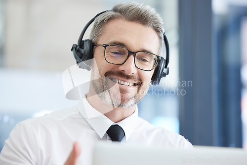 Image of Call center, customer support and senior man talking to client in telemarketing, friendly service and crm company. Communication, contact us and male consulting agent with headset in customer service