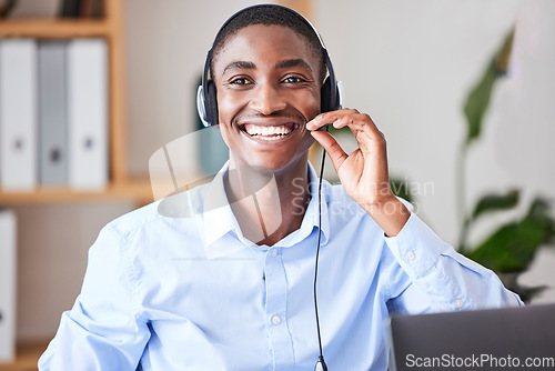Image of Call center, consulting and smile with businessman in office for telemarketing, customer service and technical support. Help desk, contact us and crm with black man and microphone for sales advisory