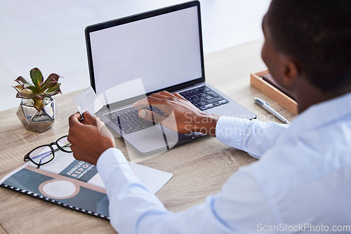 Image of Credit card, laptop mockup and businessman with fintech, ecommerce or online shopping website for financial wealth, payment and startup loan. Corporate hands, finance black man and banking on screen