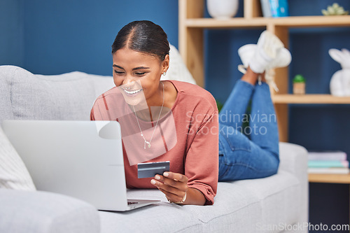 Image of Credit card, laptop and woman relax on sofa online shopping, ecommerce website and shop fashion sale in living room. Black woman, happy customer and digital tech purchase with bank card or bank app