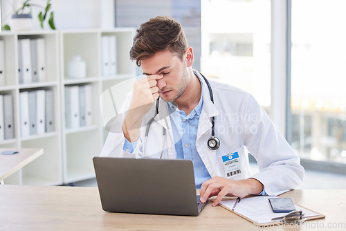 Image of Headache, tired and stress of doctor from digital results, computer glitch and work risk. Burnout, working and consulting healthcare worker with anxiety from medical, health clinic and medic report