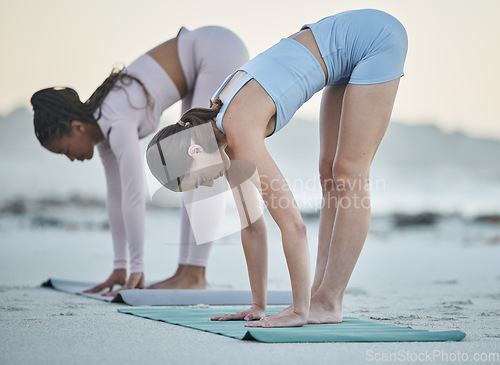 Image of Diversity, women at the beach and doing yoga stretching for flexibility training, body healthcare exercise and mental focus. Leg stretch, outdoor pilates fitness workout and woman with friend by sea