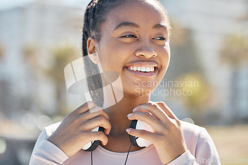 Image of Start, fitness or black woman with headphones in nature or park ready for training, exercise or workout in Miami. Sports, healthy or happy girl athlete smiles before running outdoors in summer alone