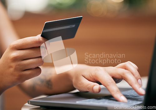 Image of Hands, laptop and credit card with a woman online shopping for a retail sale or deal as a customer. Computer, finance and ecommerce with a female consumer making a payment via the internet