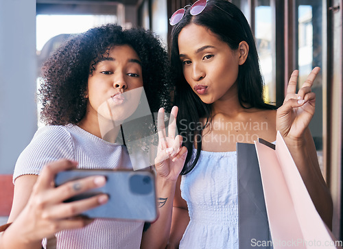 Image of Selfie, peace and shopping with black woman friends posing for a phone photograph outdoor in the city together. Mobile, hand sign and pout with a female customer and friend in a mall or retail store