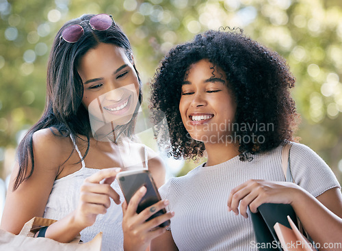 Image of Phone, shopping and black woman friends outdoor together for a retail sale or deal as a customer. Ecommerce, contact and online shopping with a female and friend using 5g mobile technology to search