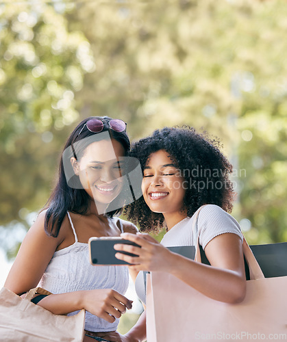 Image of Friends, phone and selfie for retail shopping bonding moment together with smile for purchase choices. Black people, shopper and smartphone photograph of happy gen z women for social media.