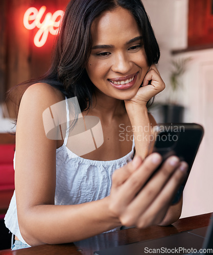 Image of Phone, social media and communication with a black woman in a coffee shop or internet cafe to relax alone. Contact, mobile and social network with a young female sitting in a restaurant or bistro