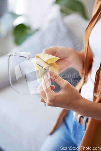Image of Woman, hands and cleaning glasses for dust, dirt and protection with fabric tissue. Closeup female with microfiber cloth for spectacles, frames and eyewear for clear vision, reading and lens eye care