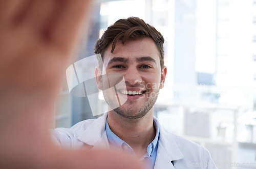 Image of Hospital, doctor and selfie of man in office with optimistic and happy smile for career opportunity. Healthcare, happiness and professional medical person at workspace in Vancouver, Canada.