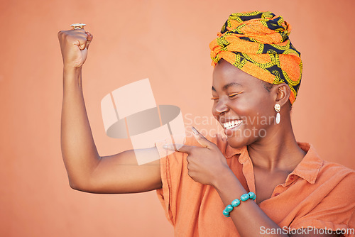 Image of Power, strong and arm flex with black woman for leadership, gender equality and confident. Muscle, proud and fitness with bicep and fist of girl for success, tough and strength in orange background