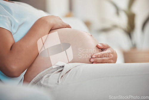 Image of Pregnant, stomach and woman with hands, pregnancy and prenatal healthcare, maternity leave and family home. Pregnant woman, hope for healthy newborn baby with mom and wellness, motherhood and relax.