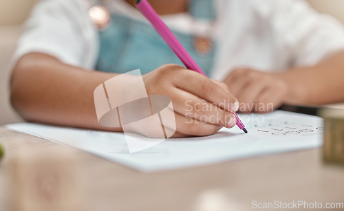 Image of Child, drawing or hands writing on paper in kindergarten education for knowledge development at school desk. Kid, creative or young student with color pencil learning or working on sketching skills