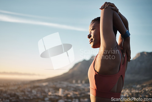 Image of Black woman, fitness or stretching arms in nature workout, training or sunset exercise in muscle pain relief, tension release or healthcare wellness. Runner, sports athlete or body warm up at sunrise