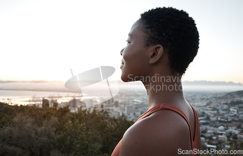 Image of Black woman, fitness or city view in sunrise workout, training or exercise for healthcare wellness, cardiovascular strength or marathon. Happy smile, sports runner or sunset break on mountains road