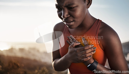 Image of Heart pain, fitness and black woman with an injury from cardio, running and nature workout in Germany. Asthma, health and African runner with heart attack risk during training on the mountain