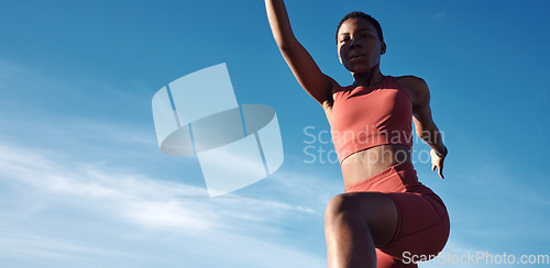 Image of Running, start and black woman on a blue sky for fitness, training and sports energy with mockup space. Motivation, exercise and portrait of an African runner stretching with a warm up in Jamaica