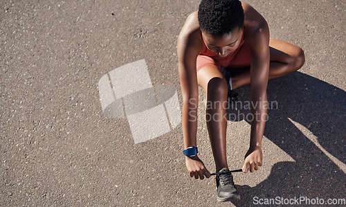 Image of Black woman, fitness and shoes in preparation for running, exercise or cardio workout on mockup. African American woman runner tying shoe lace getting ready for race, run or sports above on mock up