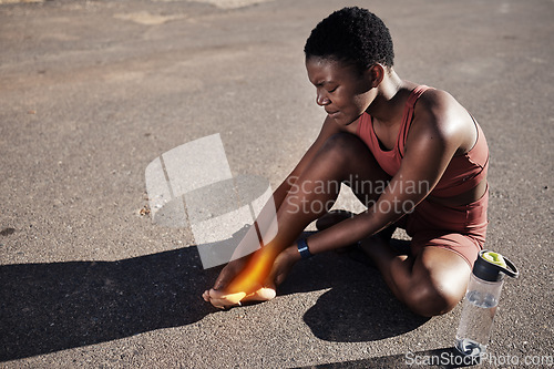 Image of Injury, running and black woman with foot pain, training accident and emergency after fitness in Morocco. Anatomy, inflammation and African runner with medical sprain in feet and street cardio strain