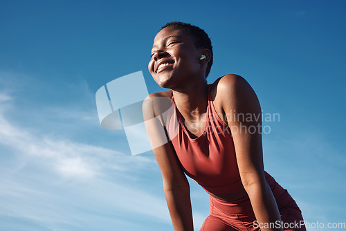 Image of Fitness, black woman and smile in relax for running, exercise or workout in the nature outdoors. Happy African American female runner smiling on a break from run, exercising and breathing fresh air