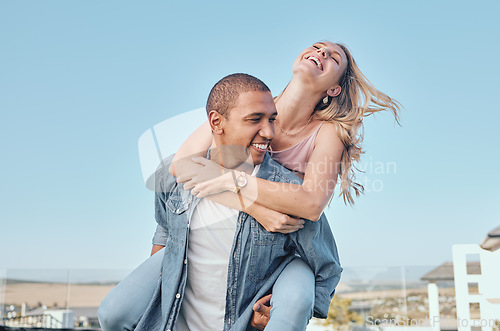 Image of Couple, interracial and love with travel and happy together, relationship with fun, piggyback ride and adventure outdoor. Black man, woman on summer holiday in Los Angeles, commitment and freedom.