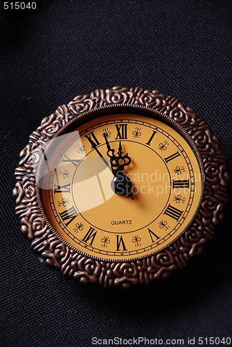 Image of old clock showing time about twelve
