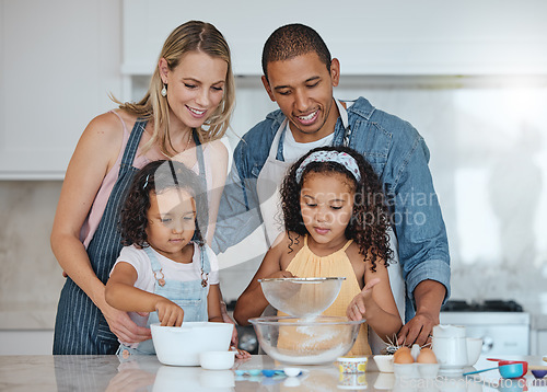 Image of Cooking, interracial and family with kids in kitchen learning breakfast recipe with flour. Bonding, wellness and mom with dad in family home teaching food preparation lesson to children.