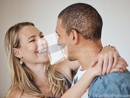 Image of Love, hug and smile with a diversity couple in studio on a gray background for romance or affection. Trust, safe and together with a man and woman hugging while bonding, dating or loving