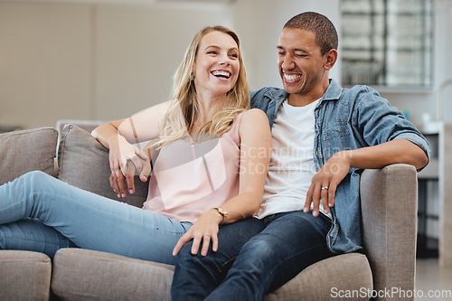 Image of Relax, funny or couple of friends love laughing at joke, story or gossip for entertainment on sofa at home. Interracial, comic or happy woman enjoying quality bonding time and holding hands with man