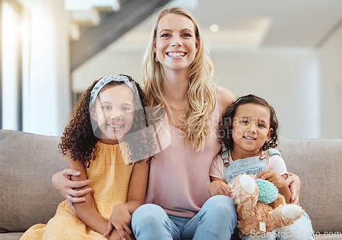 Image of Adoption, portrait and mother with kids on sofa in living room, smiling and hugging. Love, foster care and happy mom bonding with girls, having fun or enjoying quality time together in family home.