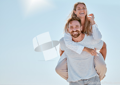 Image of Couple, piggy back and happy on vacation in summer sunshine for romance, love and bonding outdoor. Man, woman and smile on travel, adventure or holiday for honeymoon, quality time and fun in Cancun