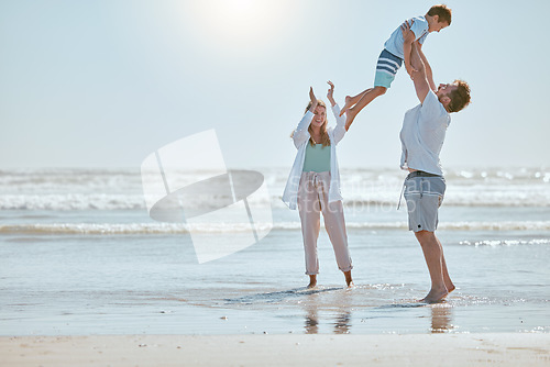 Image of Family, beach and summer vacation with mother, father and child together for fun, love and care while together in water while playing. Man, woman and kid playing airplane game on sea holiday