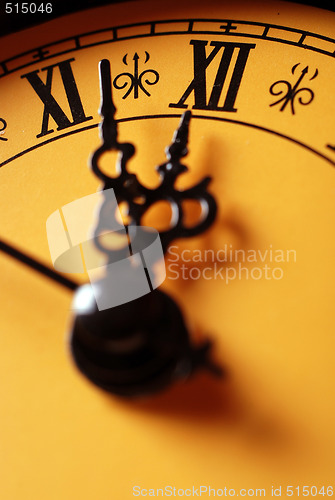 Image of old clock showing time about twelve