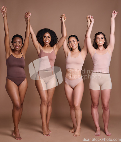 Image of Women diversity, body positivity and skin color celebration of group of model friends holding hands. Skincare beauty, trust and woman community support portrait together with global care and love