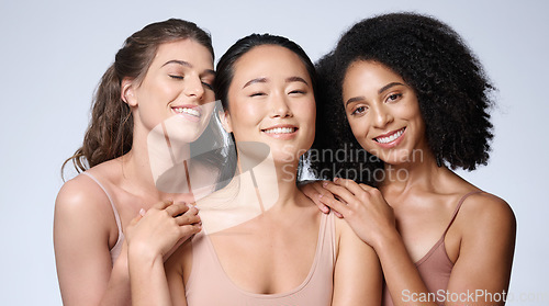 Image of Women, faces diversity or skincare glow on studio background in healthcare wellness, self love empowerment or community support. Portrait, smile or happy beauty models or friends and makeup cosmetics