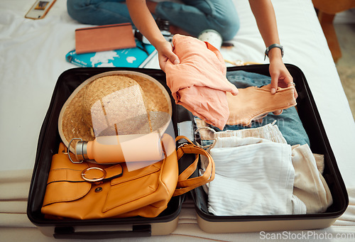 Image of Hands, woman and suitcase on a bed for travel, adventure and summer vacation, packing and clothing. Hand, girl and luggage in a bedroom for travelling, abroad and break, relax and getaway preparation