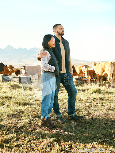 Image of Couple, farm and hug in countryside travel, trip or holiday destination with live stock in natural agriculture. Man holding woman in relationship, traveling or enjoying getaway in nature with animals