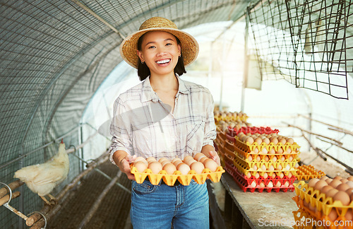 Image of Asian farmer woman, portrait and egg production for organic small business, sustainability and smile. Happy chicken farming expert, success and vision with agriculture goals in countryside with eggs