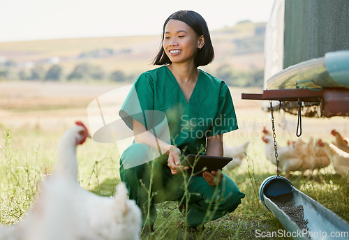 Image of Woman, veterinary worker or tablet on chicken farm in medical research, hormone medicine study or healthcare wellness check. Smile, happy or asian animal doctor on 5g technology for bird flu control
