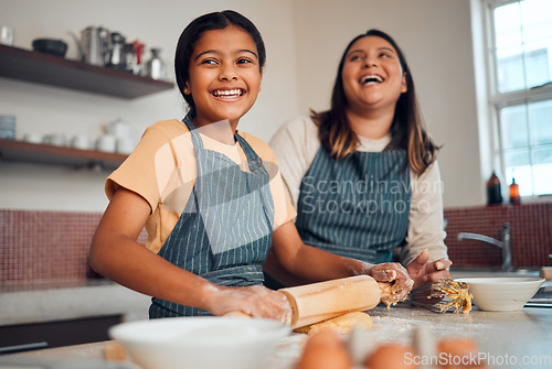 Image of Happy family, mother and girl baking a cake, cookies or muffin in a kitchen laughing at home. Eggs, funny mom and young child holding a rolling pin for flour, wheat or dough learning cooking skills