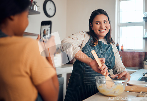 Image of Baking, tutorial and social media with a chef woman in the kitchen of her home cooking as an influencer. Food, phone and vlog with a female cook preparing baked goods while live streaming in a house