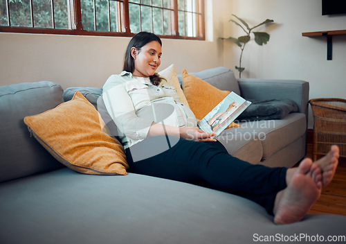 Image of Pregnancy, reading and woman with a book on the sofa for her baby, relax and peace in the living room of a house. Education, calm and happy pregnant mother with a story for her unborn child on couch
