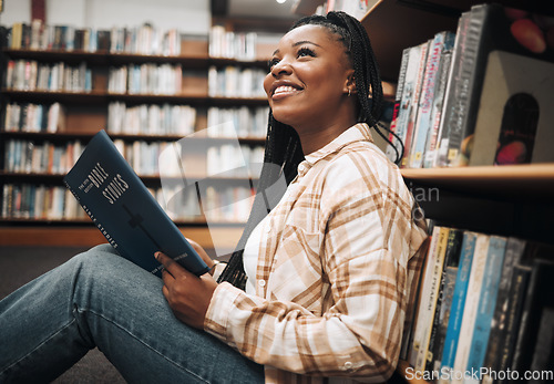 Image of Black woman student, reading or library floor for religion, study or bible in research, focus or learning. African college student, christian education or studying god book for knowledge in Chicago