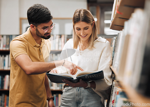 Image of Library research, reading and students with a book, studying law and learning knowledge at college. Scholarship, smile and couple of friends at university for education, study legal work and planning